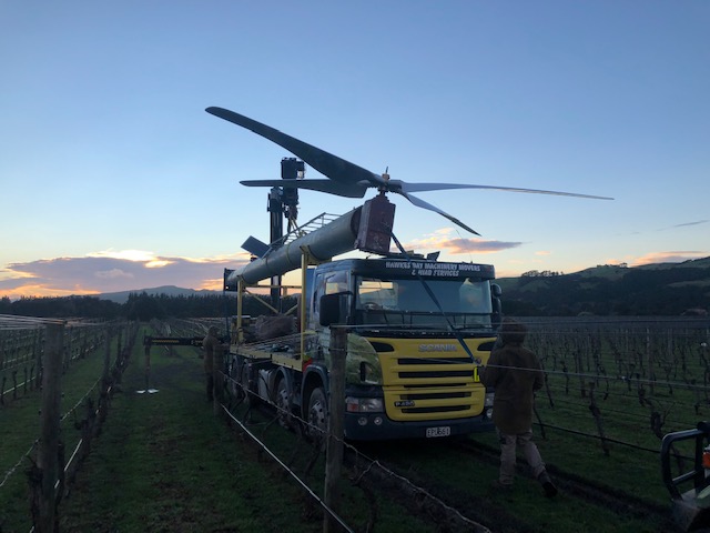 Hawkes Bay Towing truck transporting a windmill to a vinyard