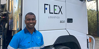 Sami from Flex Logistics in front of one of his trucks